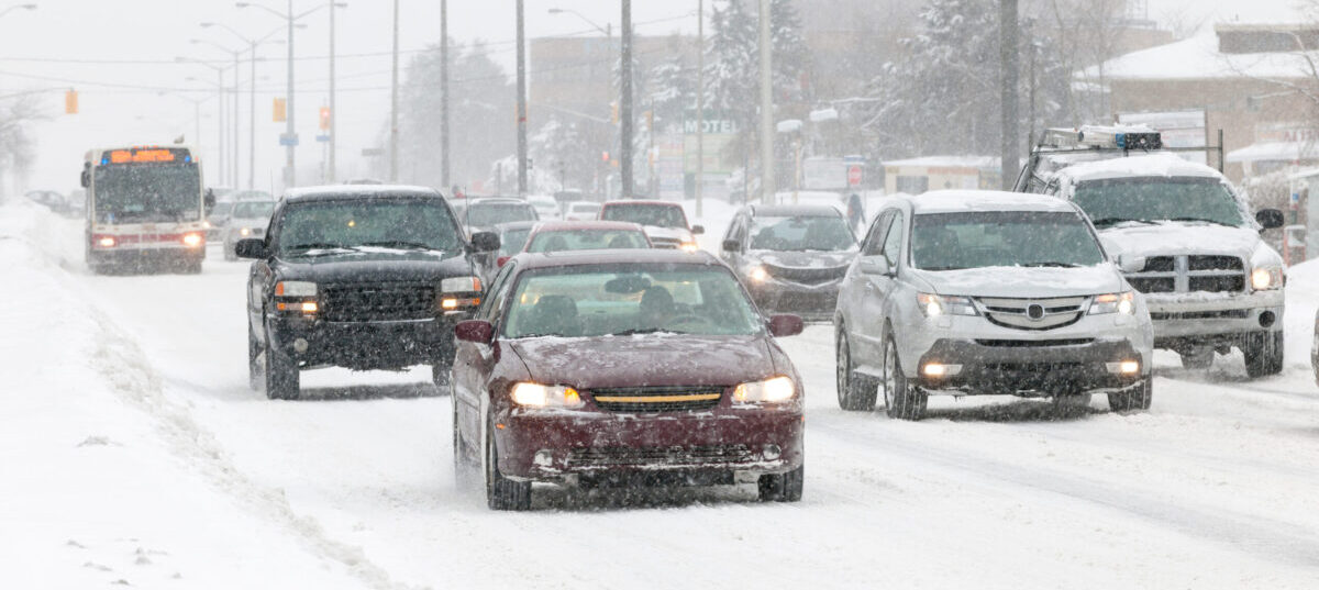 Vehicles in traffic on a snow covered roadway