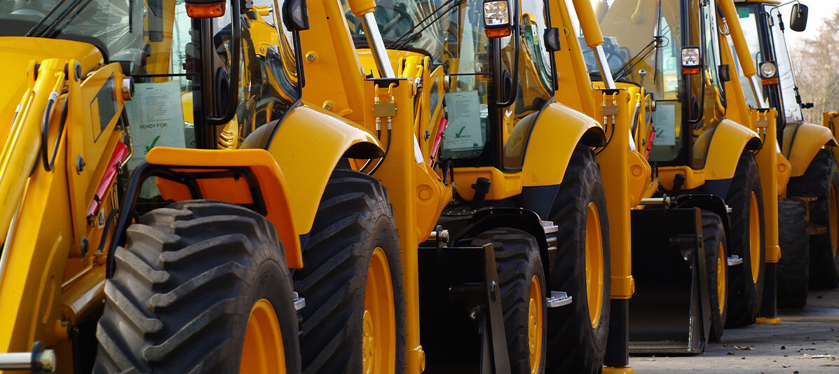 Bulldozers parked on a construction site, illustrating the importance of addressing Construction Site Closure Risks during temporary shutdowns