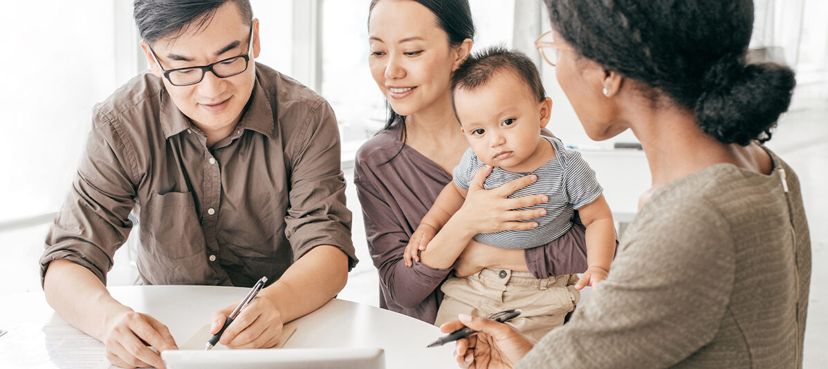 Broker discussing policy with clients