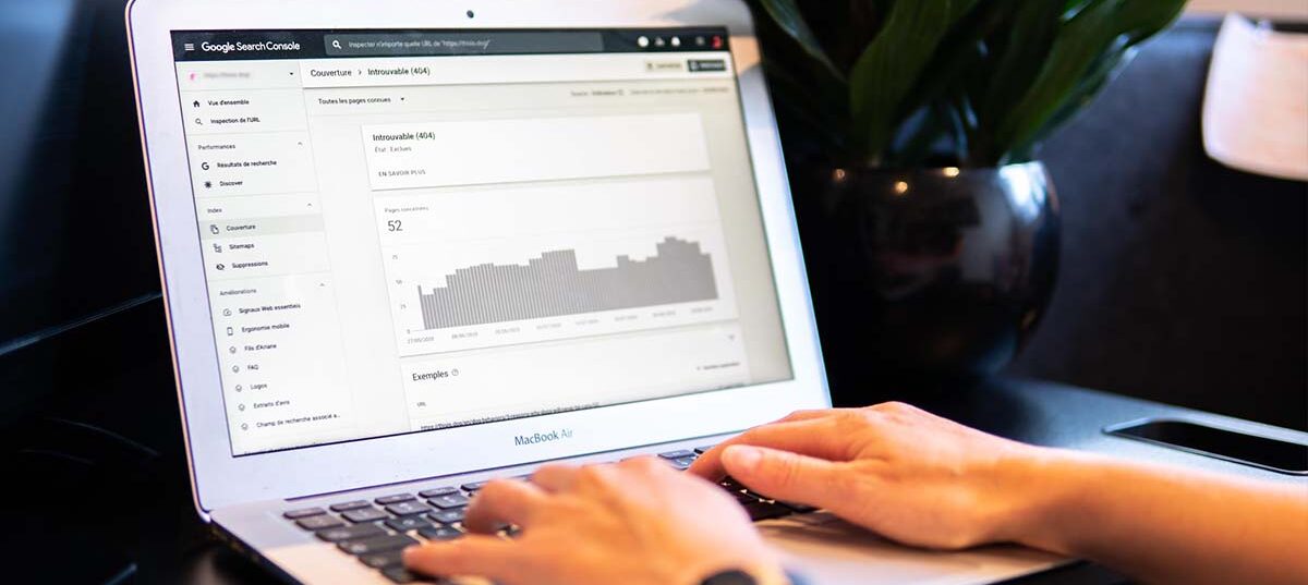 Person working on a laptop looking at analytics.