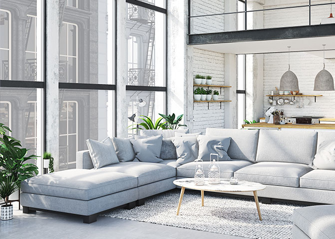 Condo interior with large windows and white furniture.