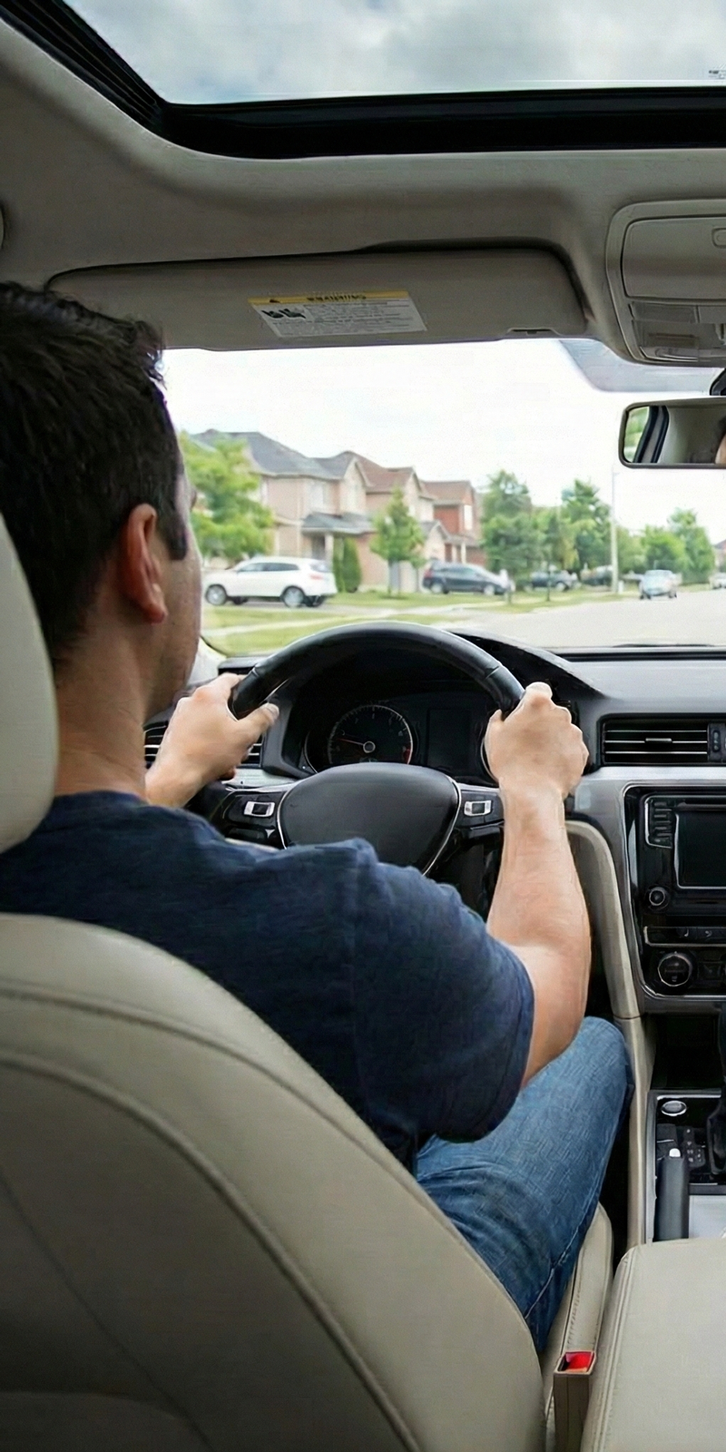 Vehicle driving in suburban neighborhood